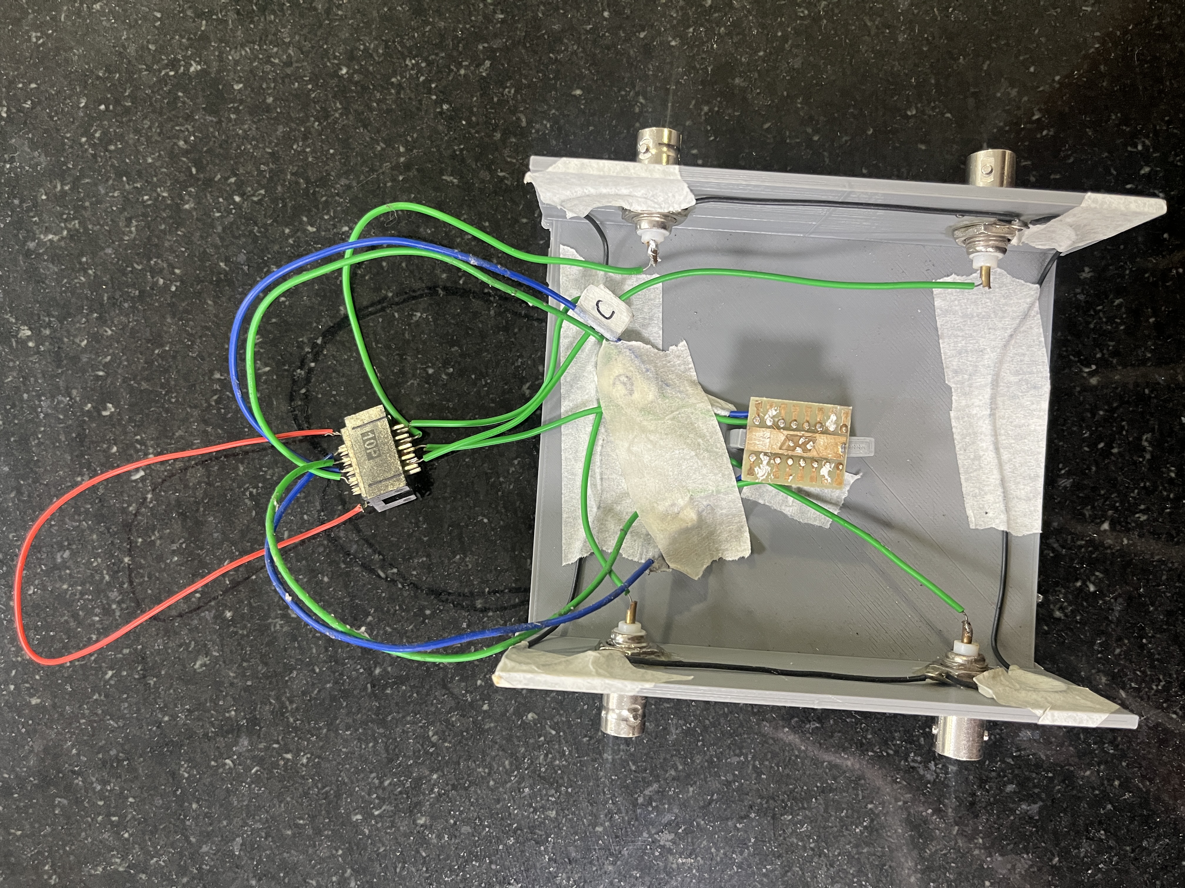 The real 3D-printed CdSe:GQD photodetector rig with BNC connectors and wiring